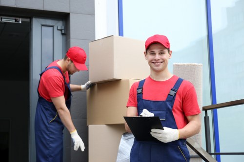 Office removals planning in Brockley with packed boxes and desks