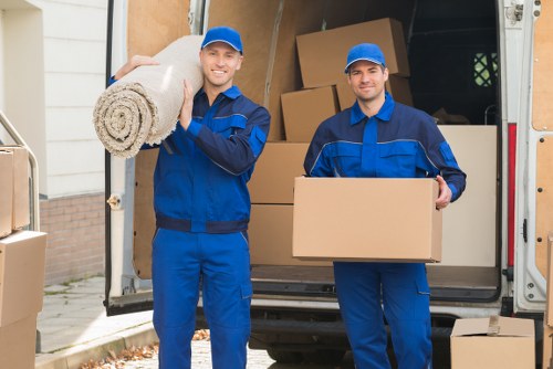 Man and van service team loading boxes in Brockley
