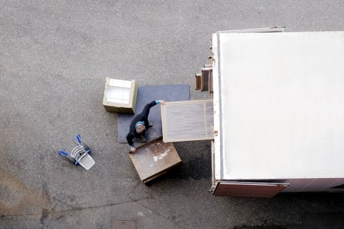 Man and van service loading moving boxes into a vehicle