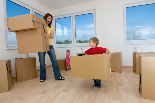 Moving team handling boxes safely during a man and van service
