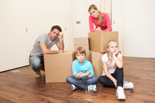 Packed moving boxes and furniture ready for house removals in Brockley