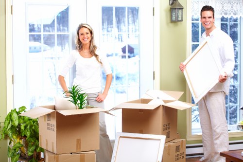Professional movers handling furniture carefully during a move